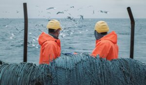 Workers aboard fishing vessel